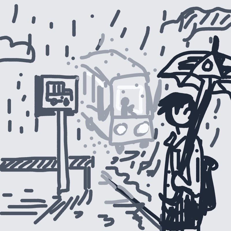 A man holding an umbrella is standing on a sidewalk in front of a train.